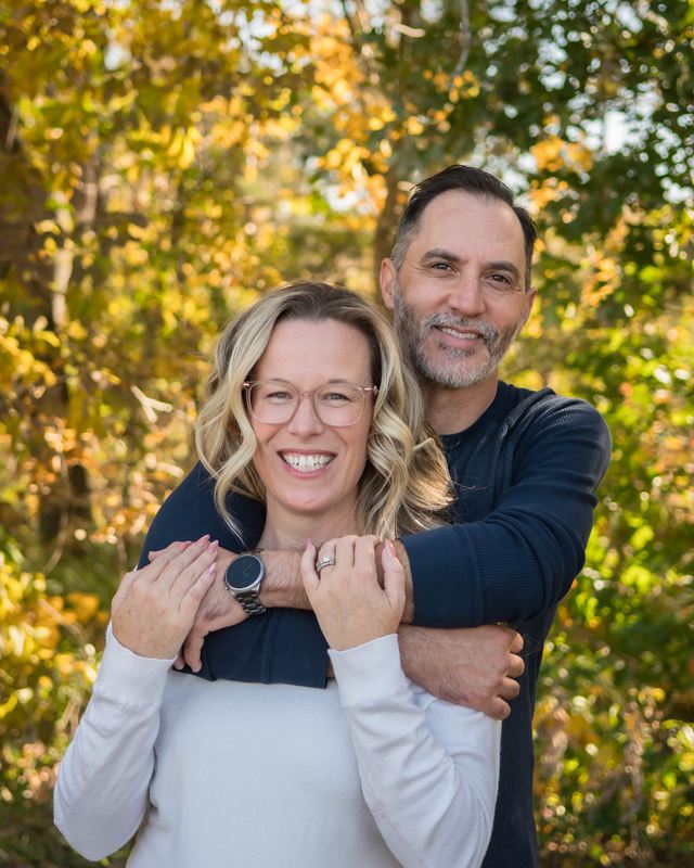 Kelly and Jeff Mirabella outdoors in the fall