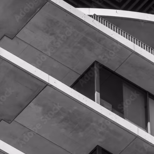 preferred equity investments represented by modern concrete building panels and a glass window
