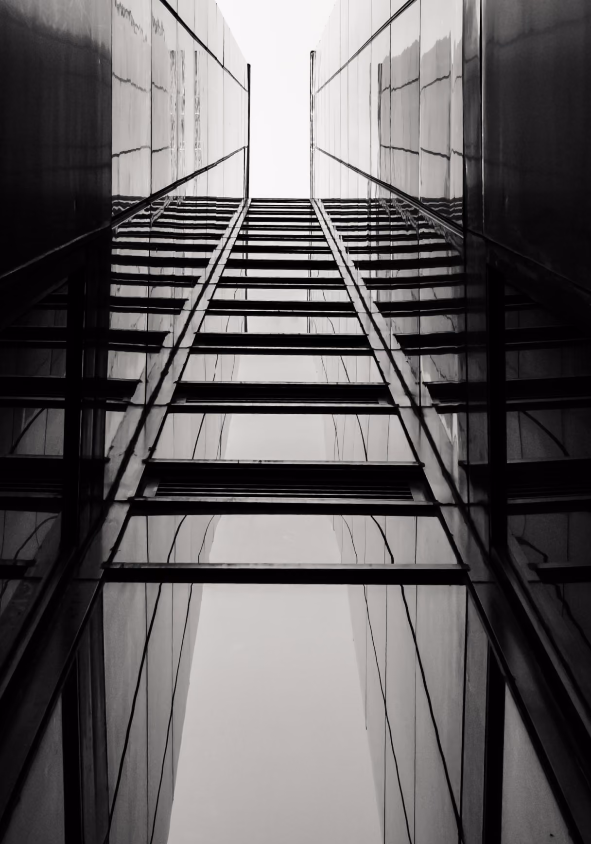 family office structured capital represented by glass skyscrapers rising into a bright sky