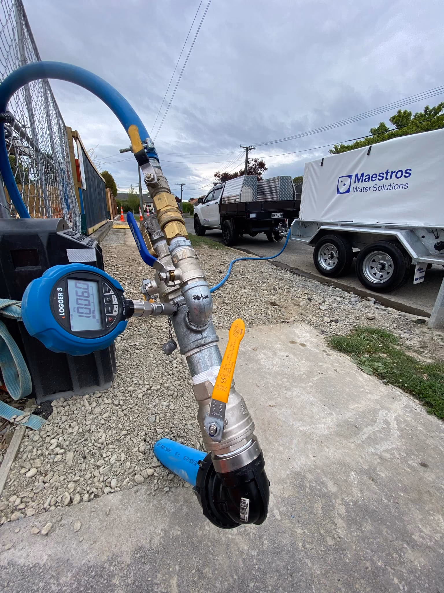 A Maestros Water Solutions trailer next to a pressure gauge.
