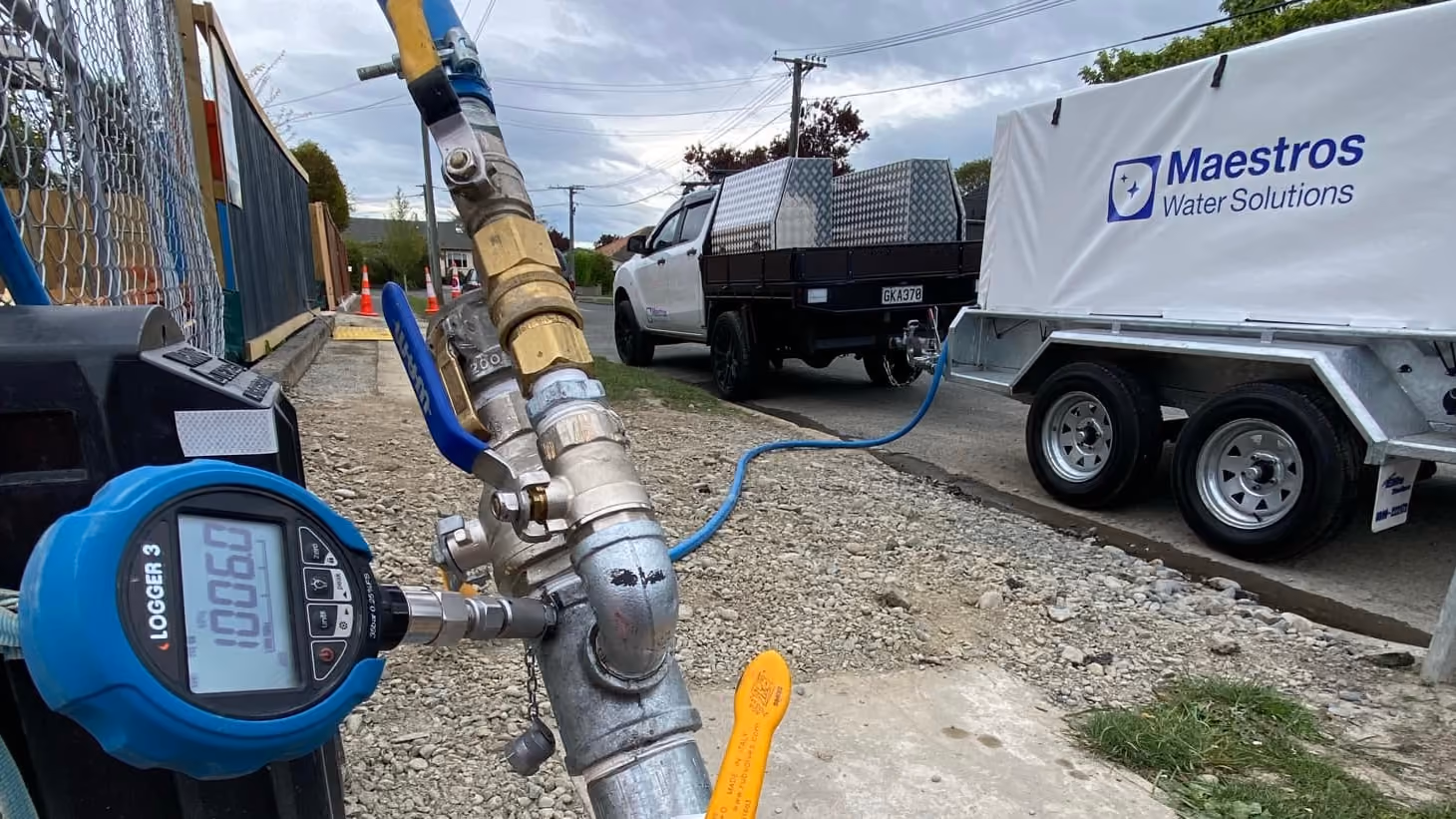 A Maestros Water Solutions trailer next to a pressure gauge