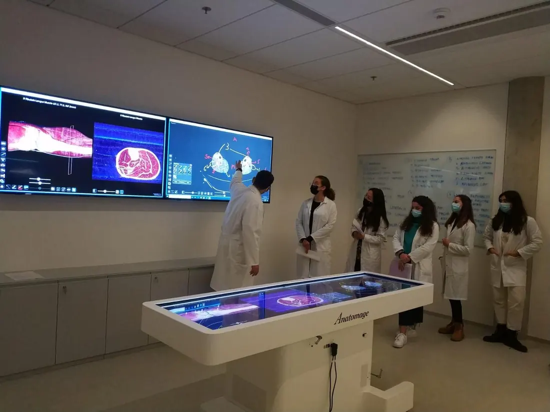 Students around an interactive anatomy table at the SIMU centre of Masaryk University