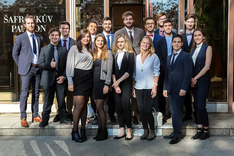 A group of students in front of the Šafránek Pavilion of Charles University in Pilsen