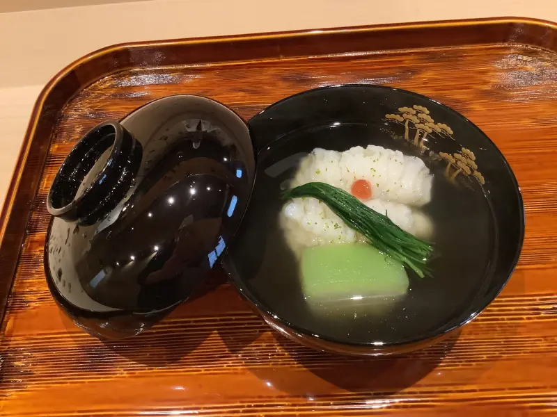 Botan hamo soup at Gion Hanamai, served in a black lacquer bowl on a wooden tray.
