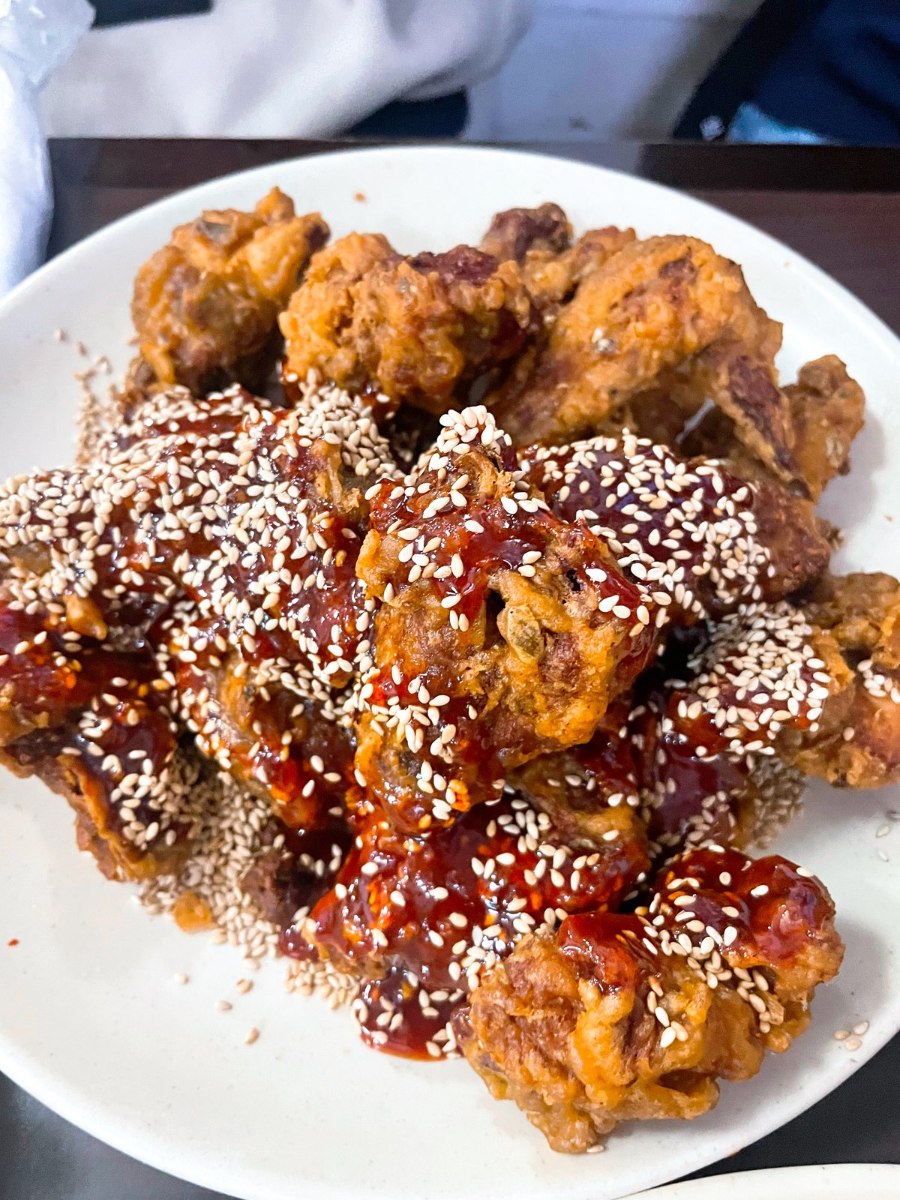 Plain and sauced fried chicken with sesame seeds at Hanchu, archive photograph from 2025.