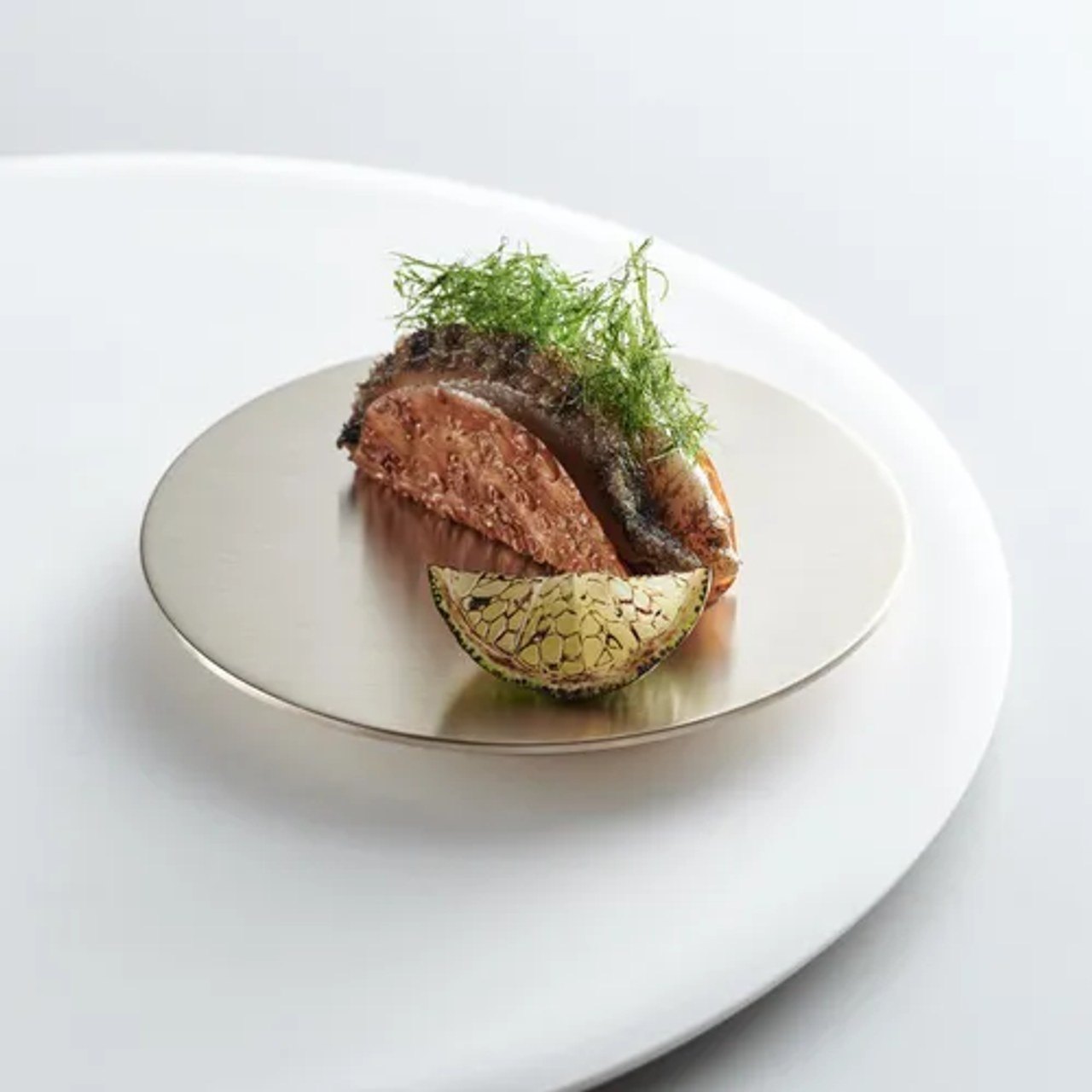 Mosu’s abalone taco in a crisp shell, shown in the restaurant’s Michelin image gallery.