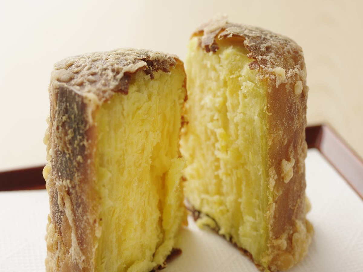 Thick sweet-potato tempura at Tempura Kondo, cut open to reveal its yellow interior.