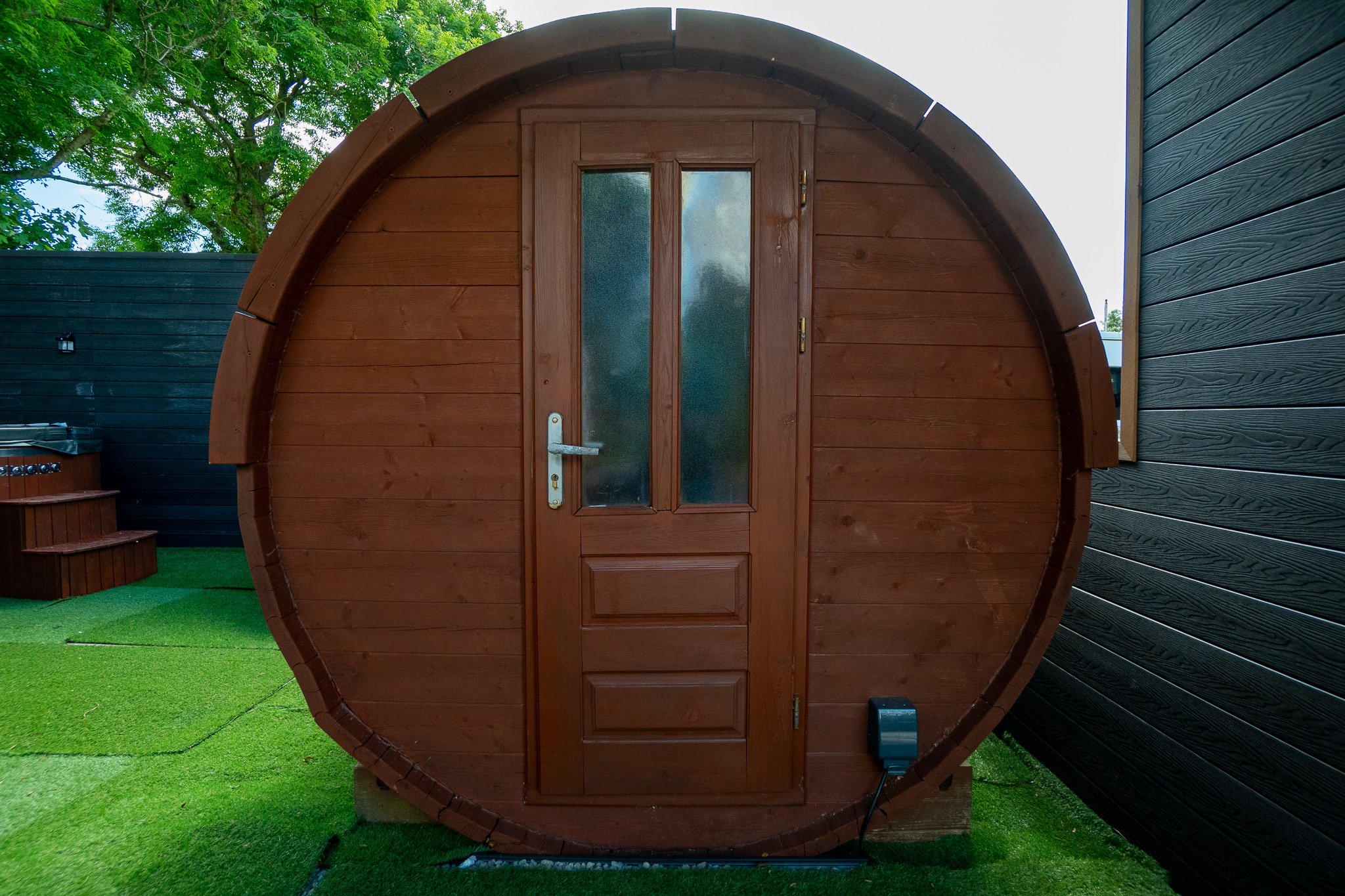 The two hot tubs and barrel sauna in the grounds at The Briers