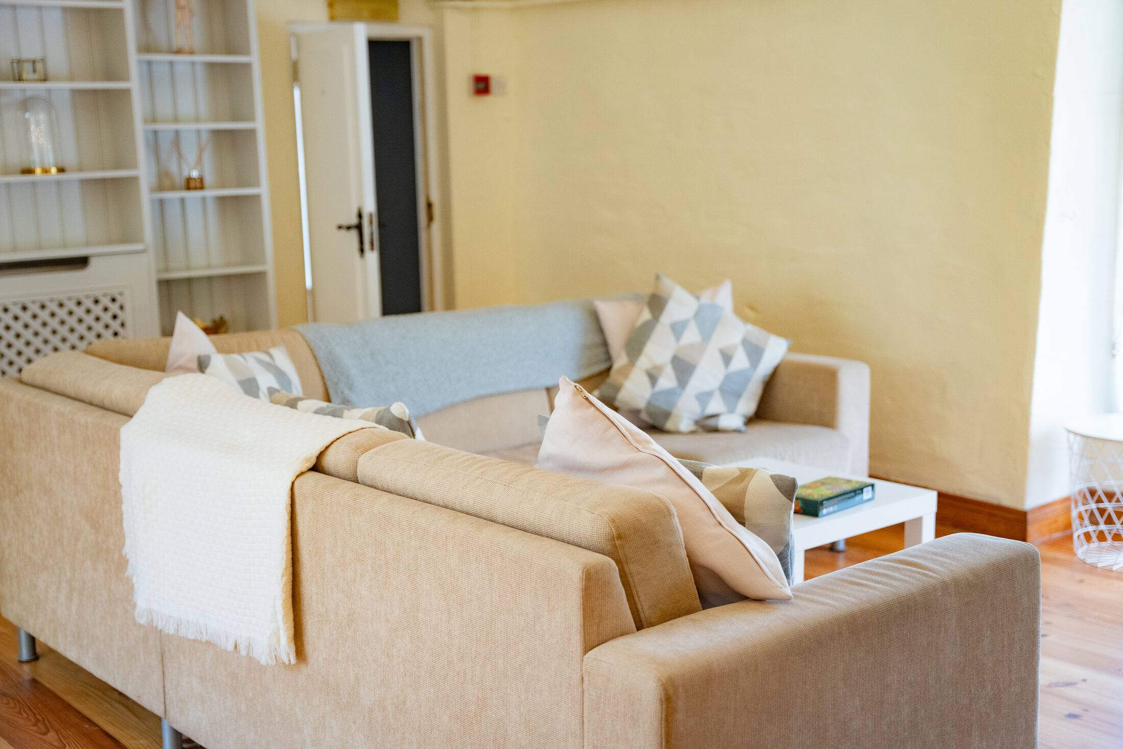 Sofas and shelving in the cottage living room at The Briers