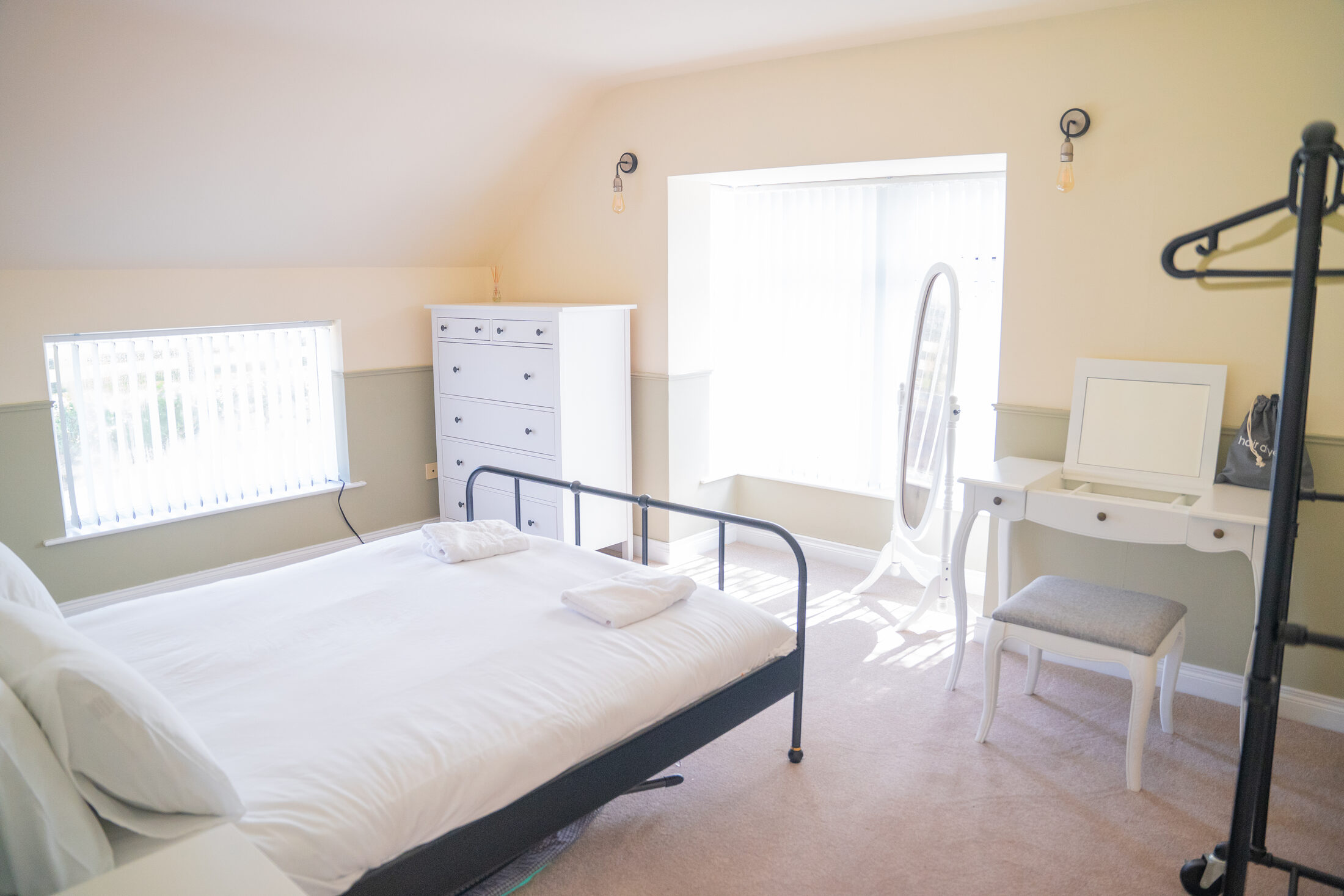 The second double bedroom in the cottage, with a dressing table and mirror