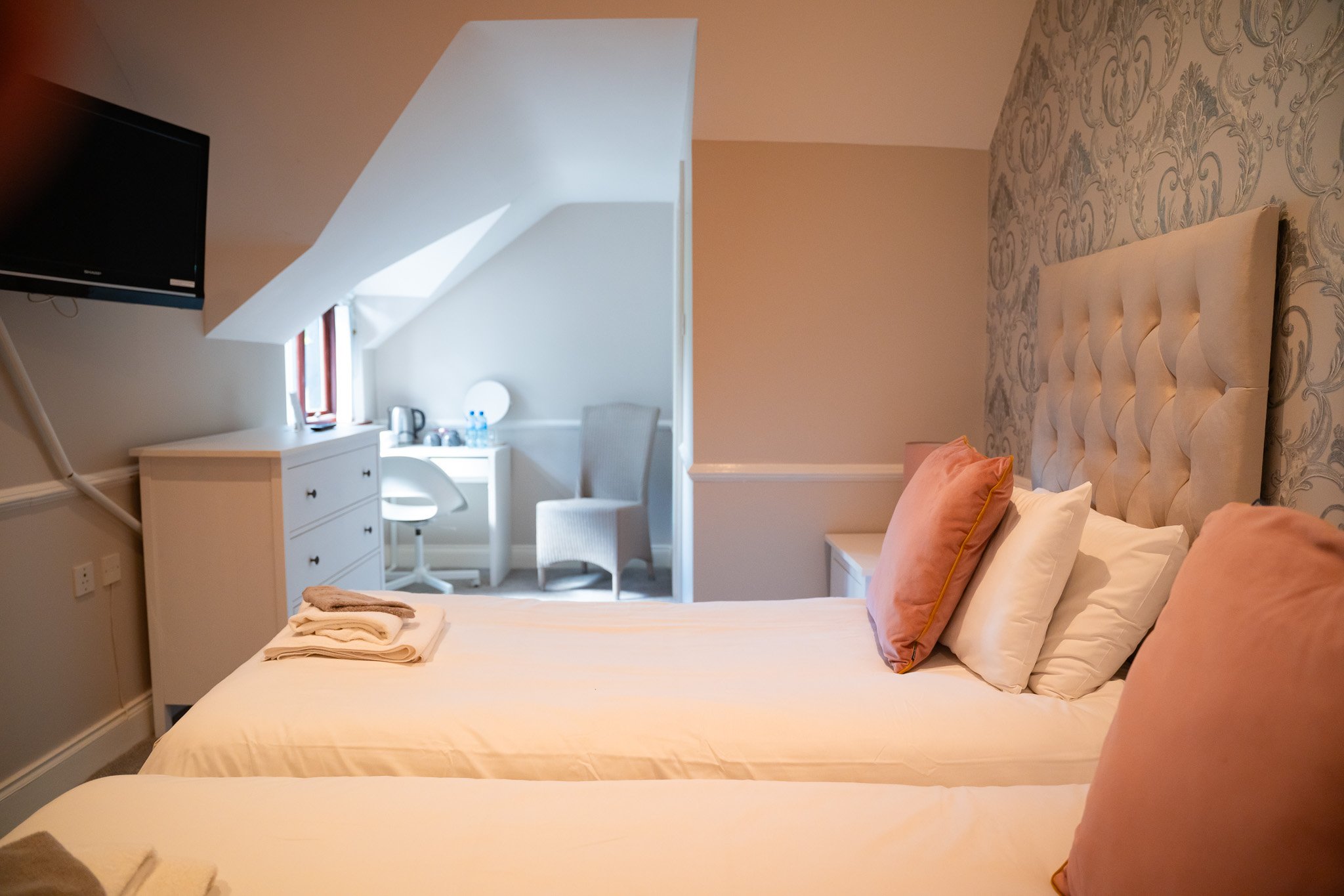 A family room at The Briers with a double bed and bunks