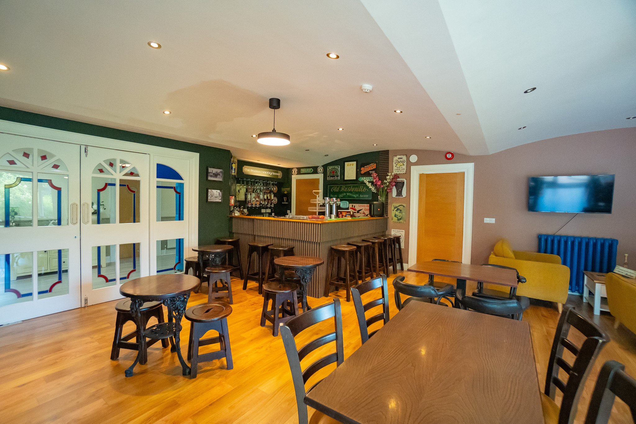 The long dining table at The Briers, open to the bar
