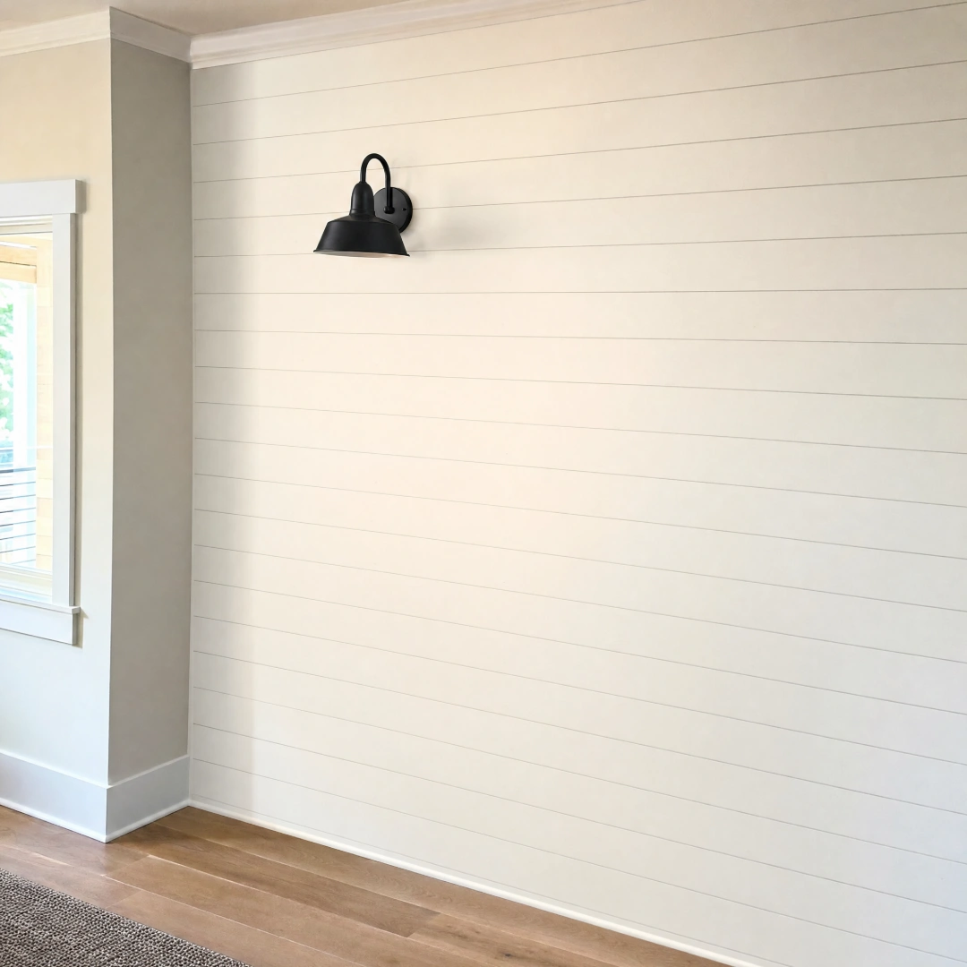 Painted shiplap accent wall installed as a feature wall in a remodeled bedroom