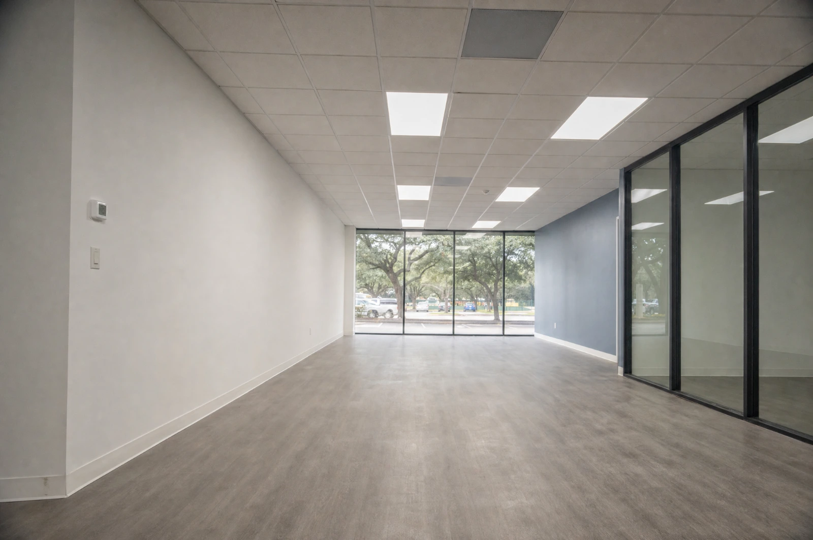 Finished tenant suite with new ceiling grid, LED troffers, painted walls and luxury vinyl plank flooring