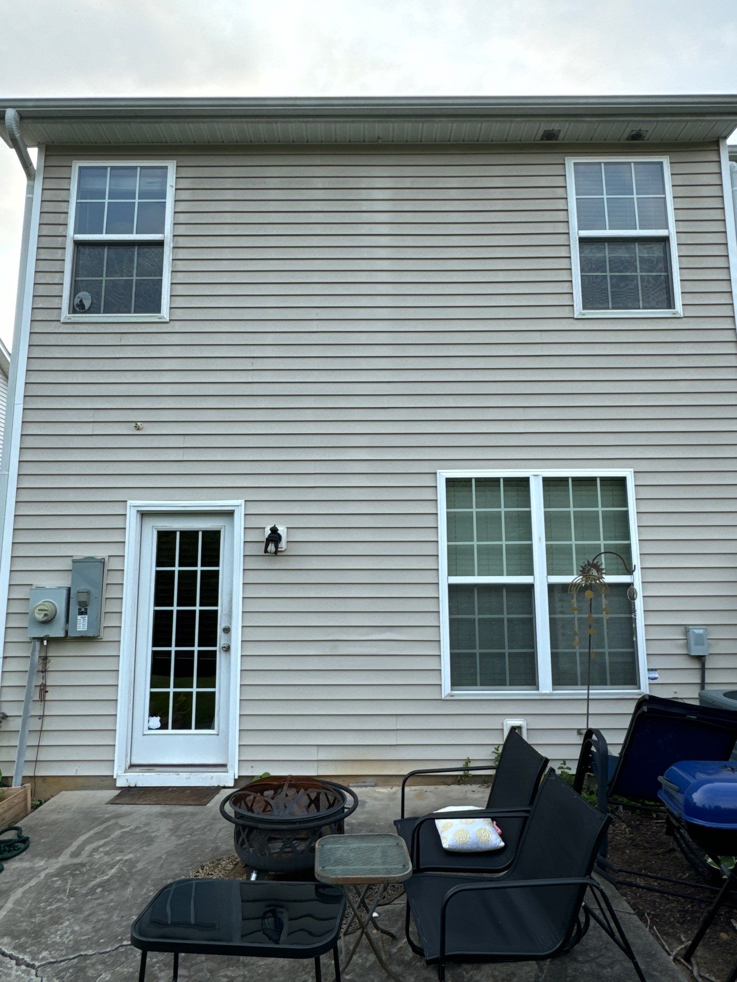 pressure washing exterior siding windows and doors removing dirt and mildew restoring appearance