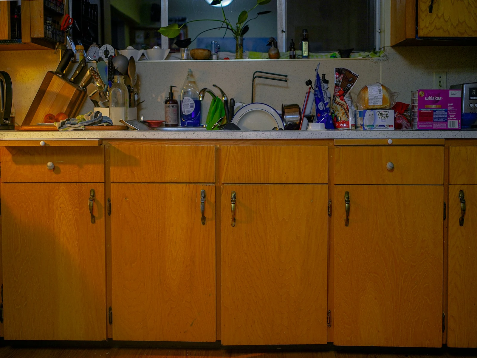 Cost of ignoring small website problems: a cluttered kitchen counter piled with dishes