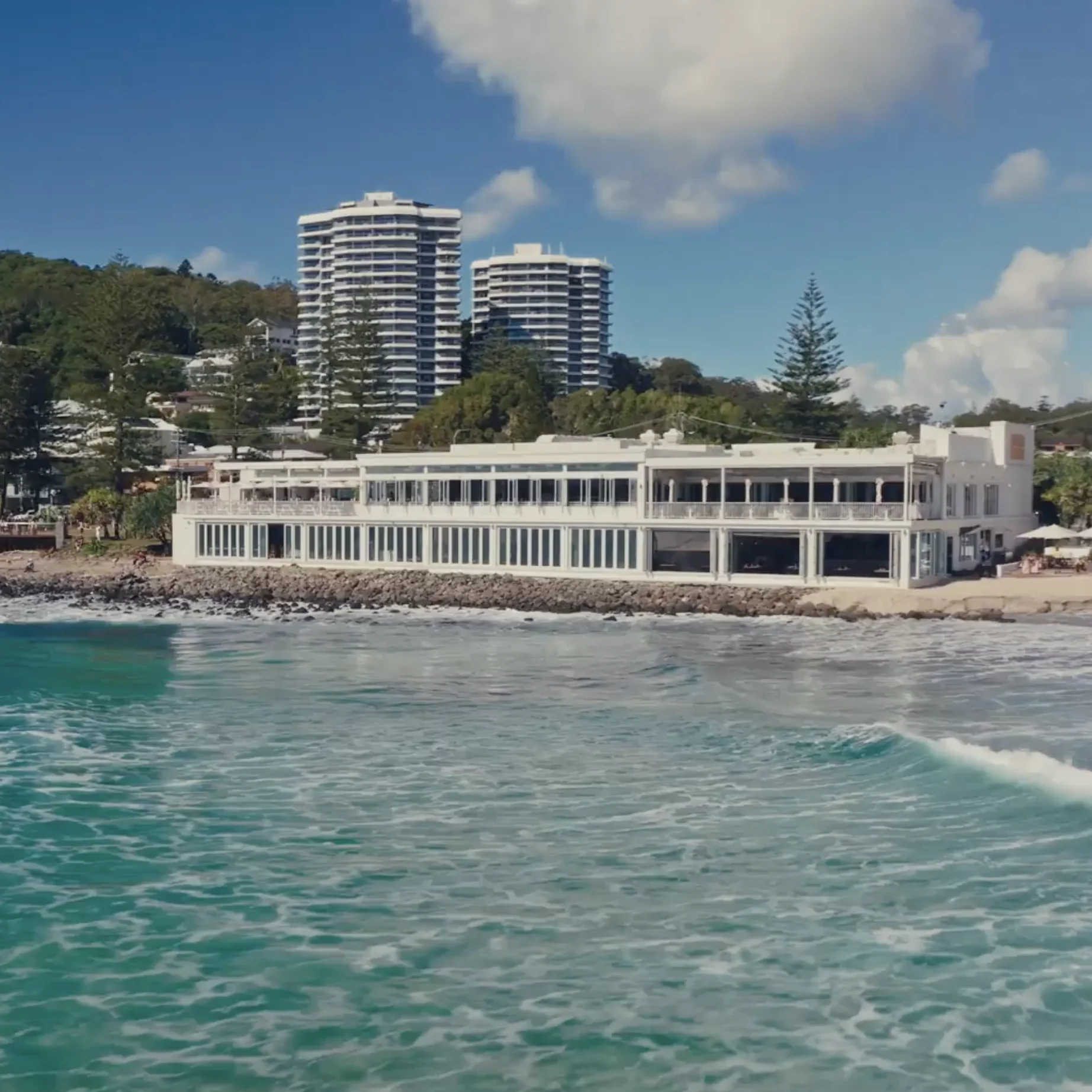 Drone shot of Burleigh Pavilion from the sea, showing the full beachfront venue.