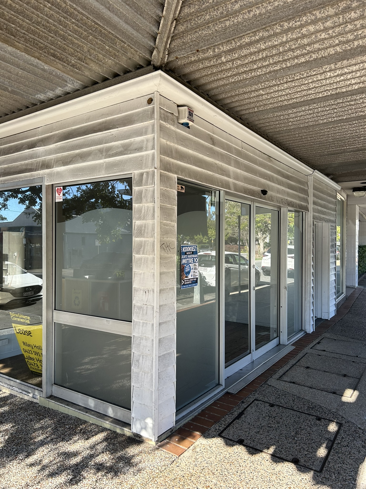 A commercial shopfront entrance before cleaning