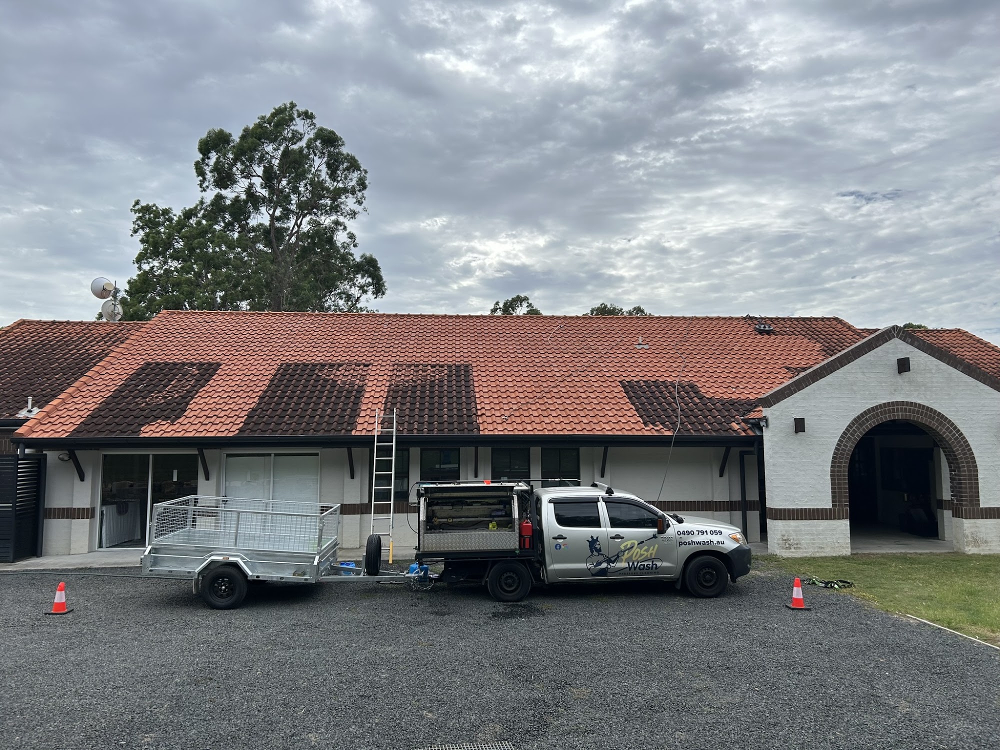 Exterior cleaning at a Brisbane school with SWMS in place
