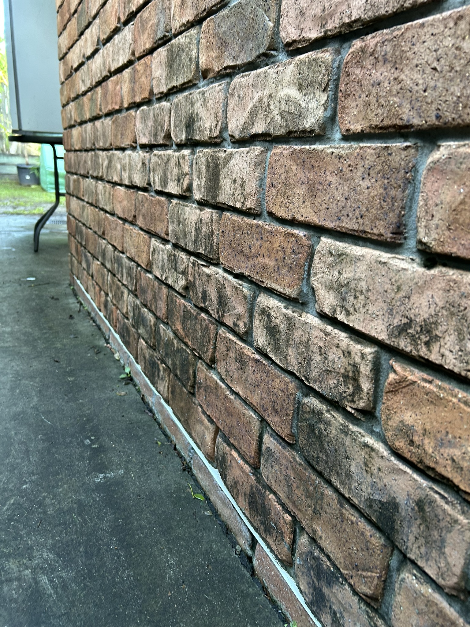 Dirty exterior brickwork before cleaning