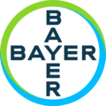 Bayer logo featuring the word 'BAYER' intersecting vertically and horizontally inside a circular gradient ring transitioning from green to blue.