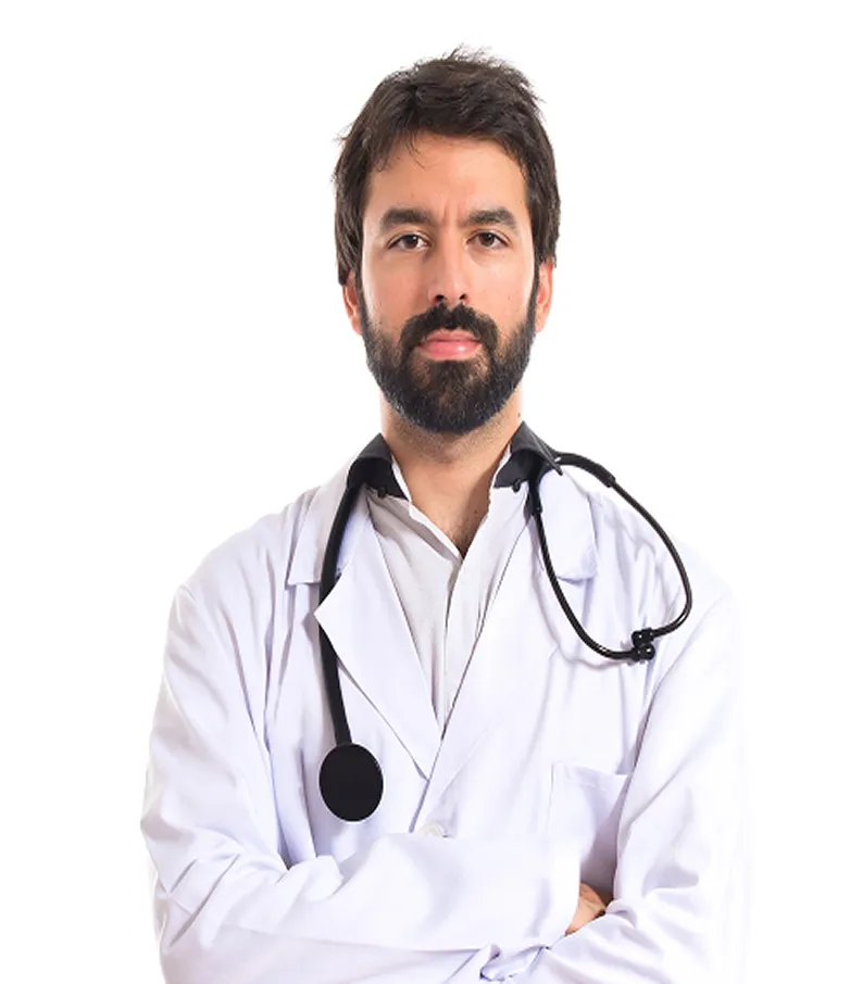 Male doctor with dark hair and beard wearing a white lab coat and a stethoscope around his neck, standing with arms crossed against a white background.