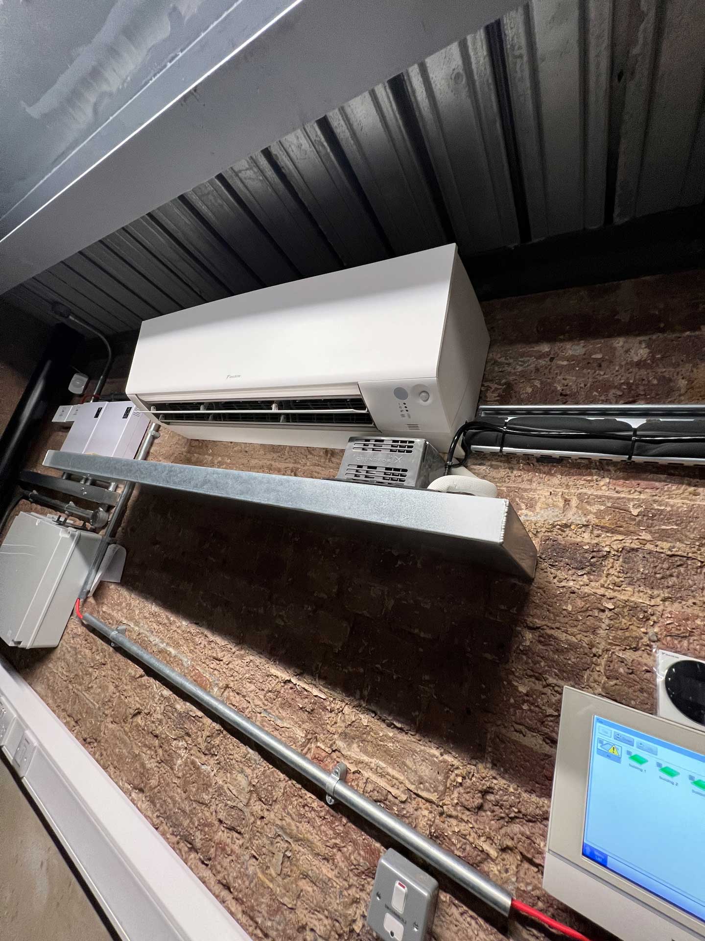 A wall mounted interior air conditioning unit