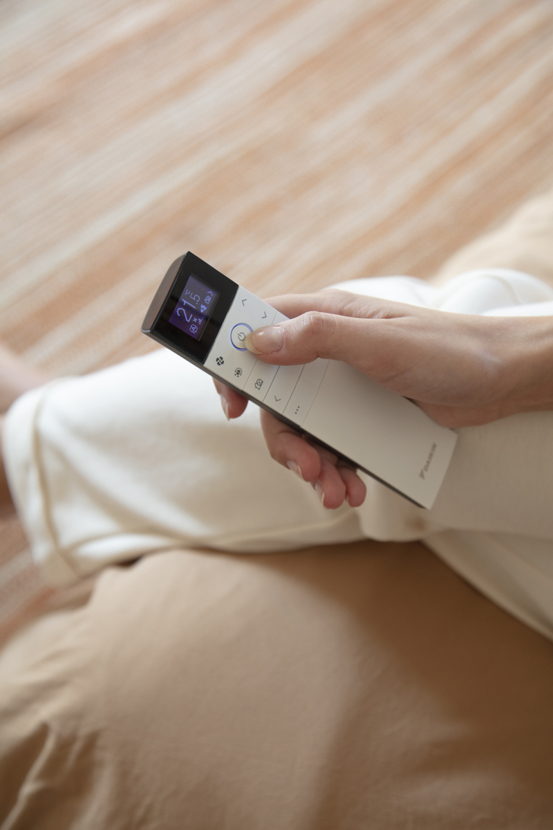 Handheld air-conditioning controller with a digital display