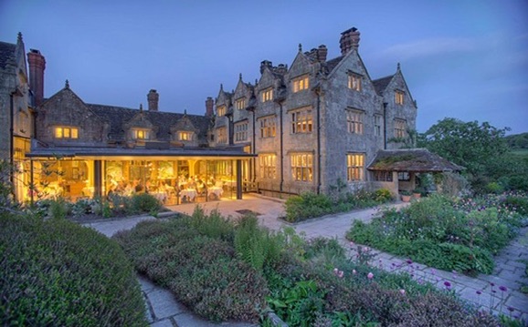 Gravetye Manor and its gardens at dusk
