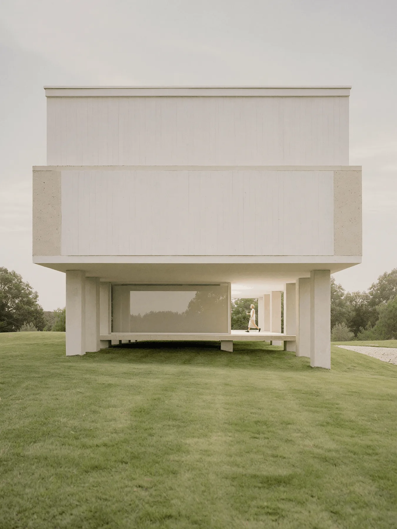 White minimalist house on a lawn