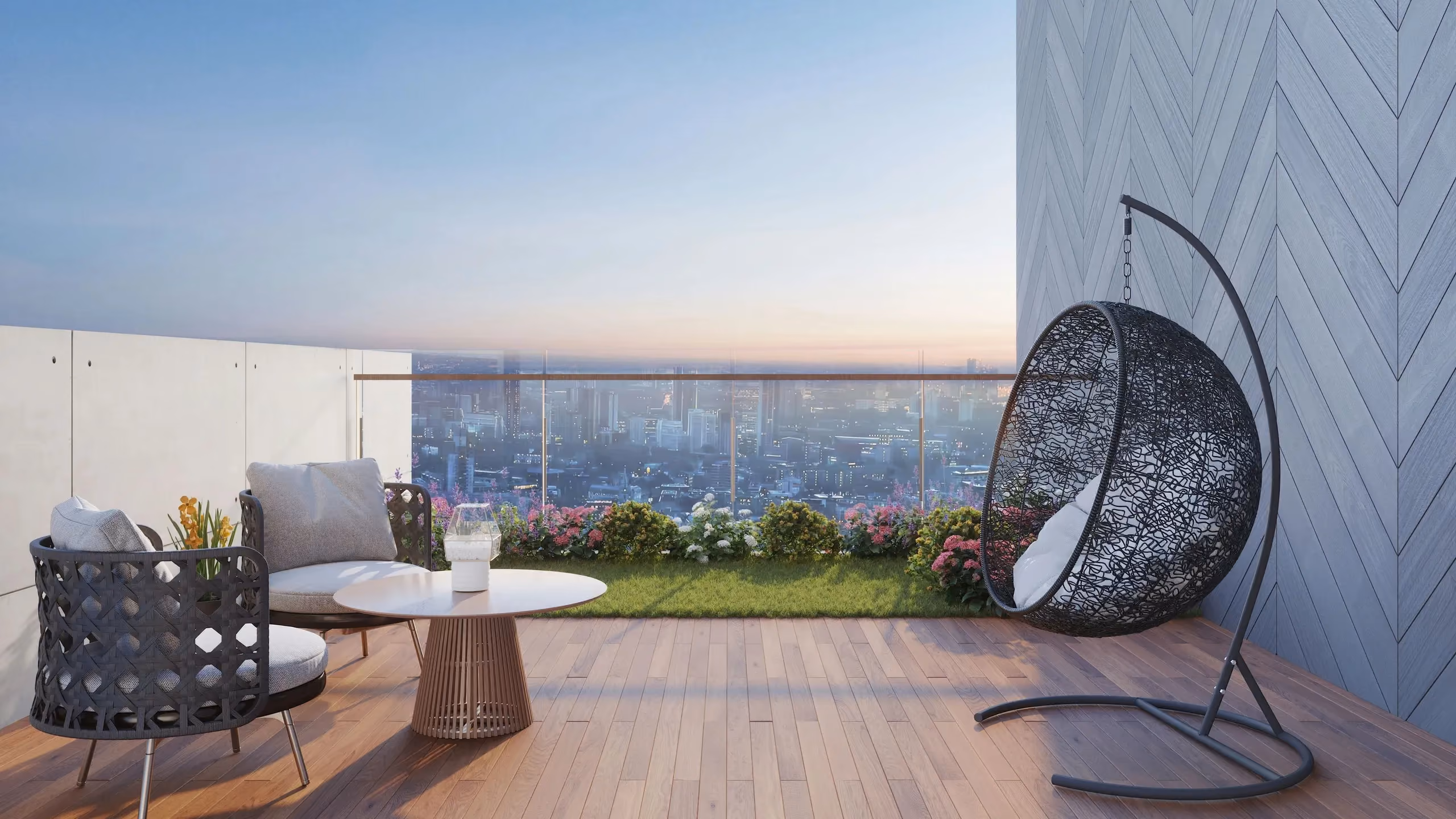Rooftop terrace with a hanging egg chair overlooking the city at dusk
