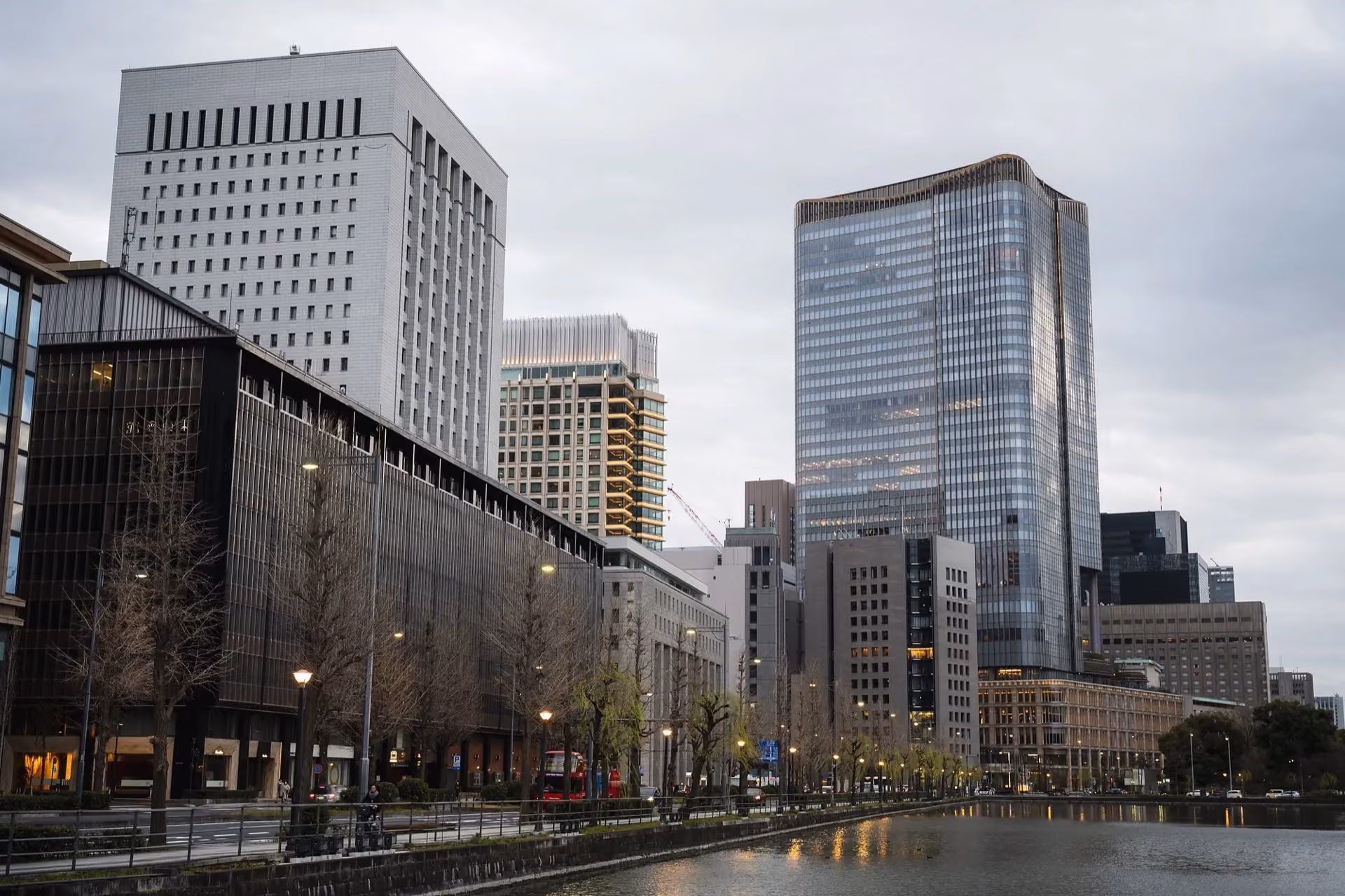 Office buildings lining a canal under an overcast sky