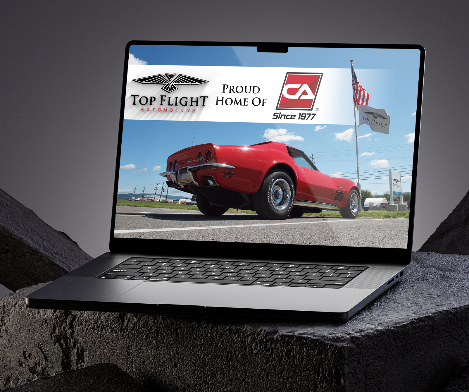 Open laptop displaying a webpage with the headline 'Result Driven Design For Fast Growing Team' on a dark textured surface.