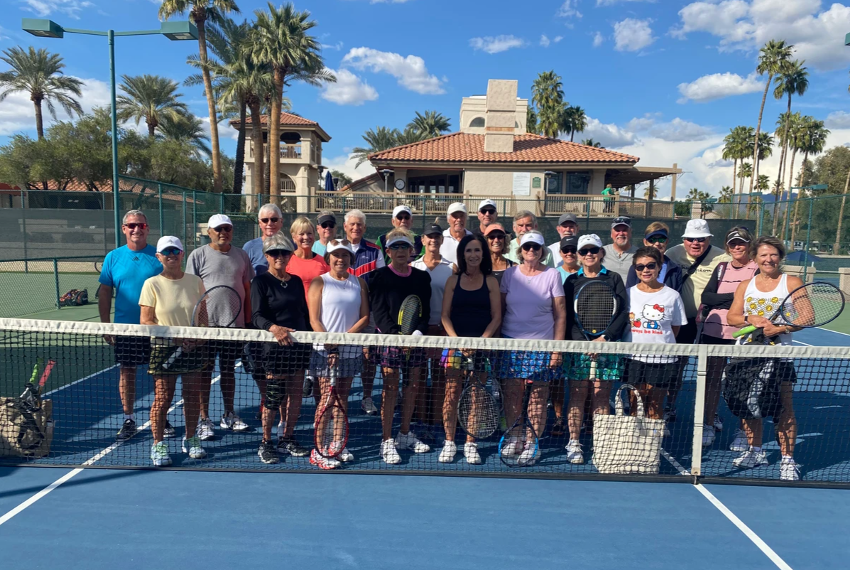 March Mixer participants gathered across the court in front of the clubhouse.