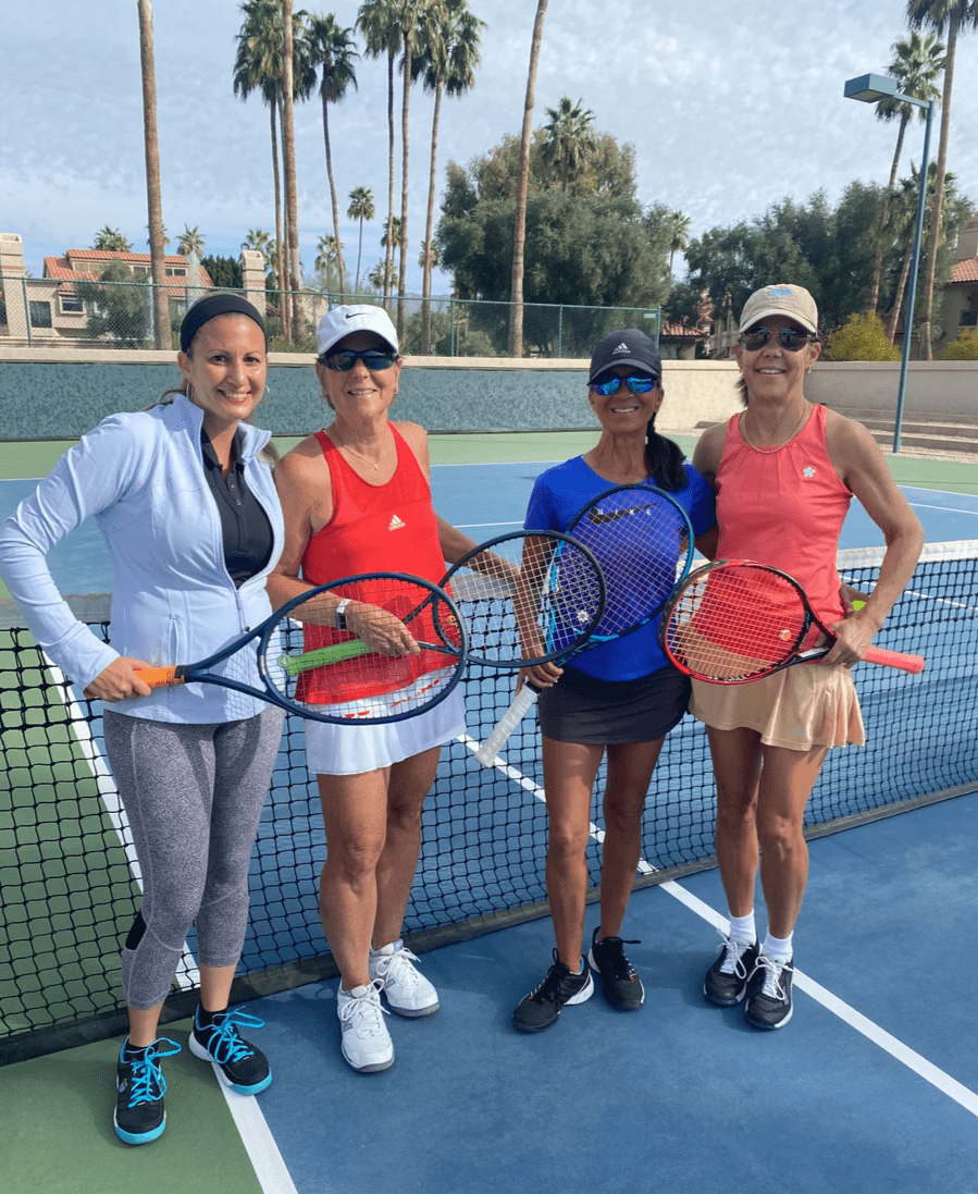 Four players with racquets standing together at the 2024 women's doubles championship.