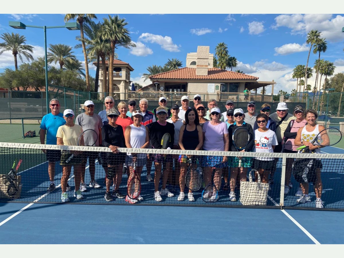 March Mixer participants gathered across the court in front of the clubhouse.