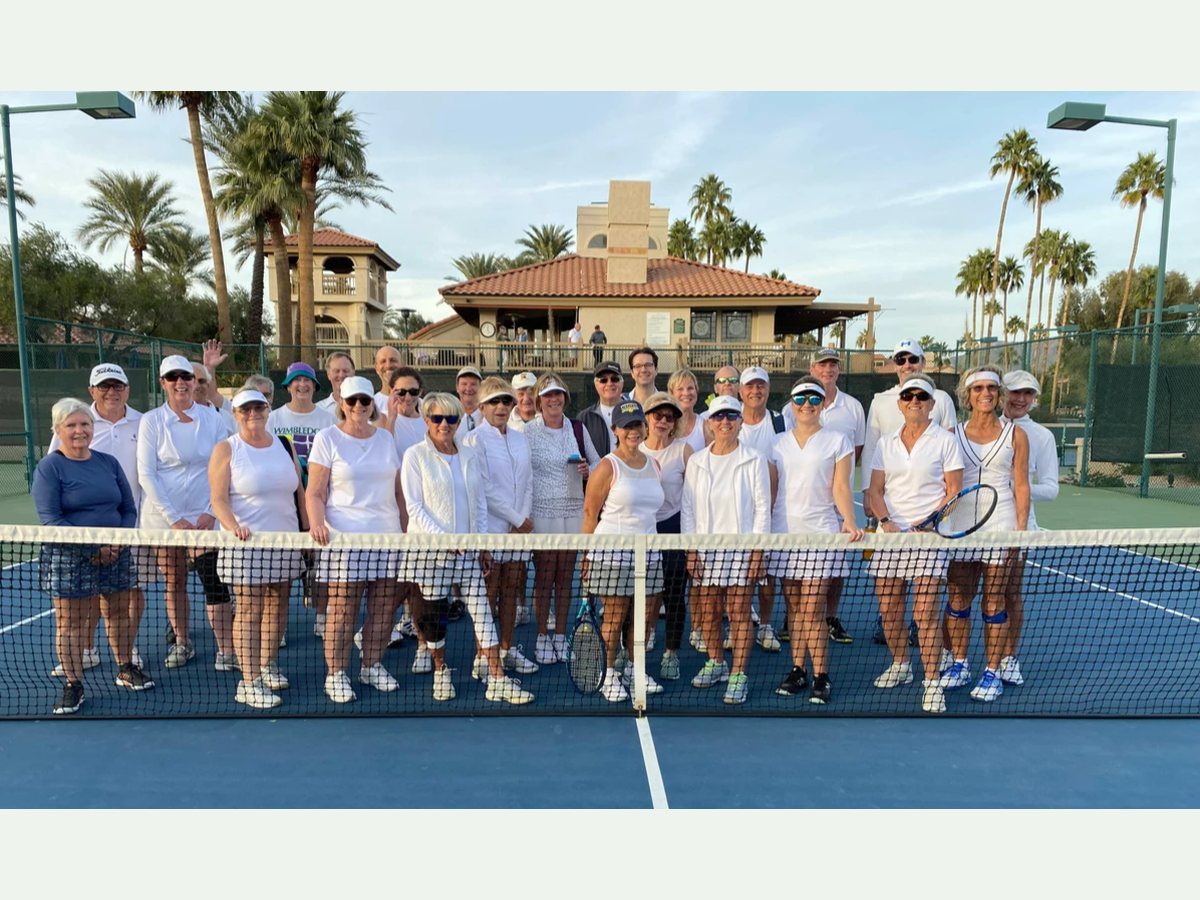 Wimbledon in January participants dressed mostly in white and lined up across the court.