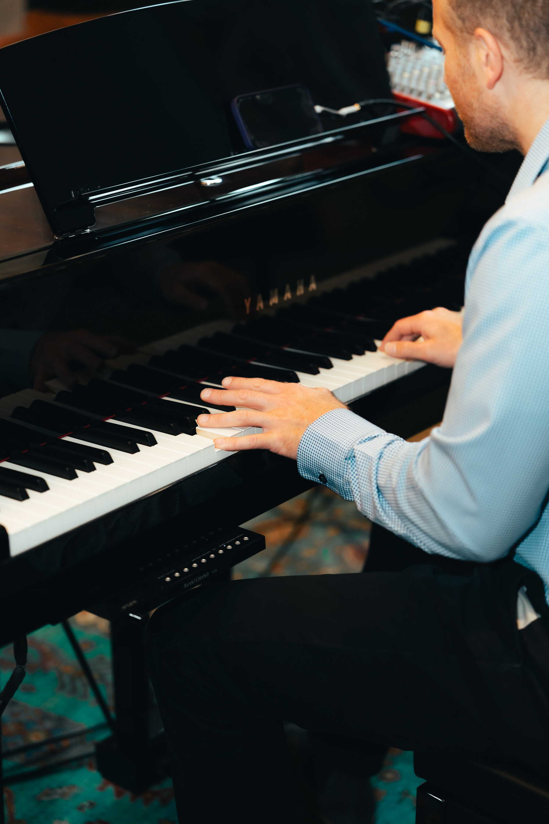 Pianist playing a Yamaha piano