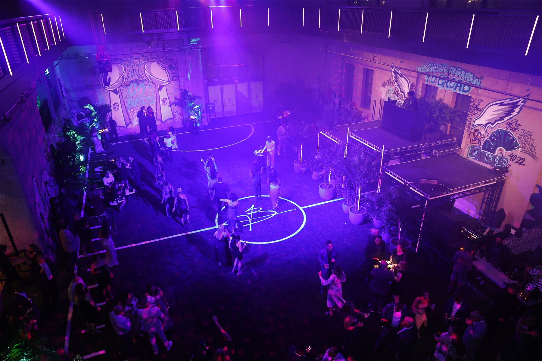 Purple-lit celebration on the Ballers basketball court