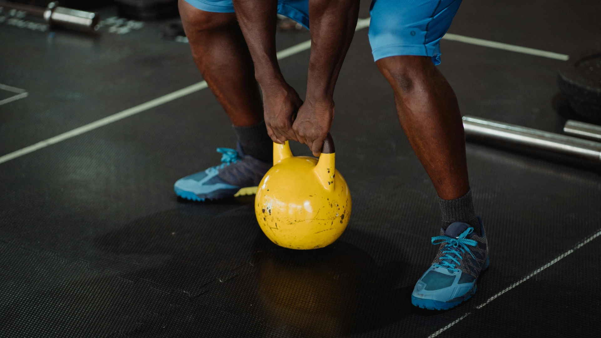Athlete performing a kettlebell exercise during strength training at The Strength Yard in West Palm Beach, FL.