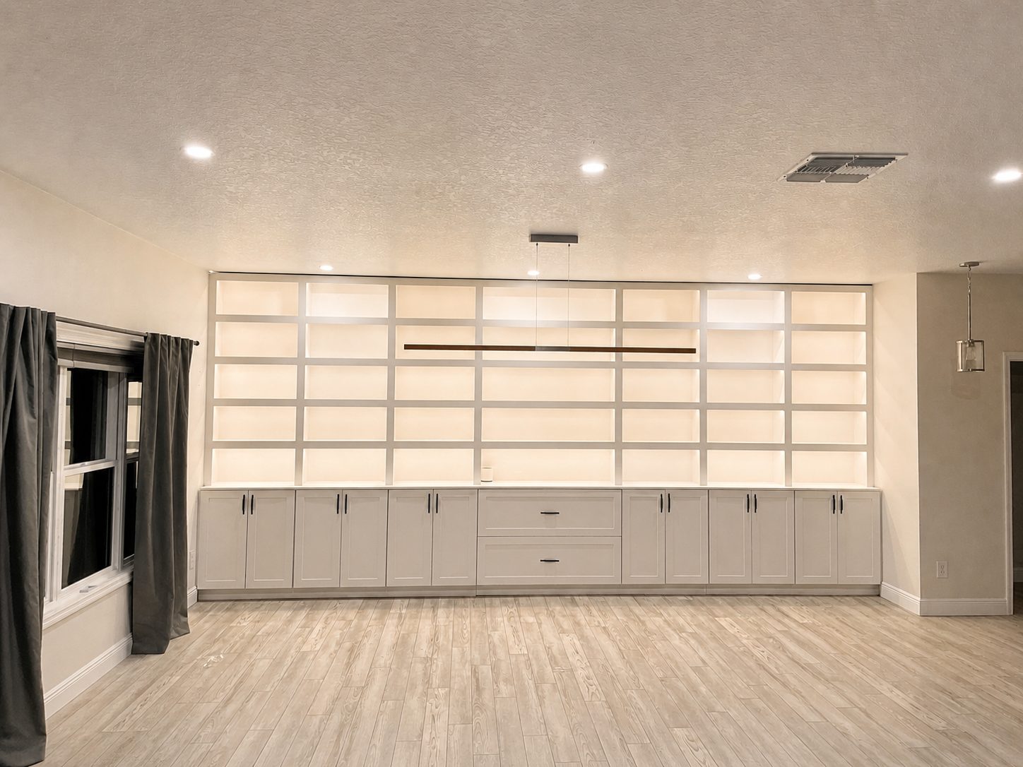 Custom built-in library shelving with LED-lit bays