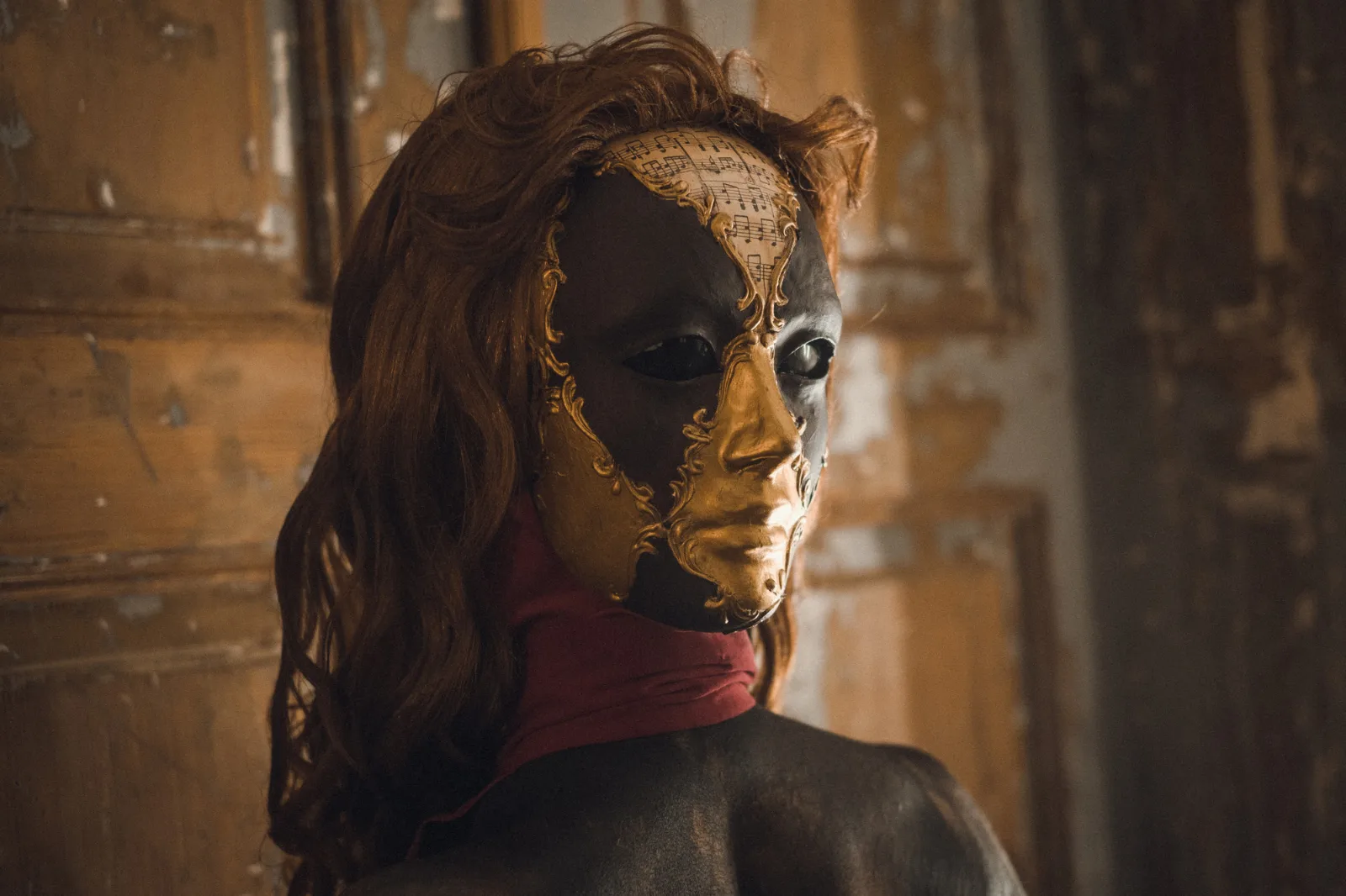Your Dream – a woman with long hair, half of her face covered by a cracked mask