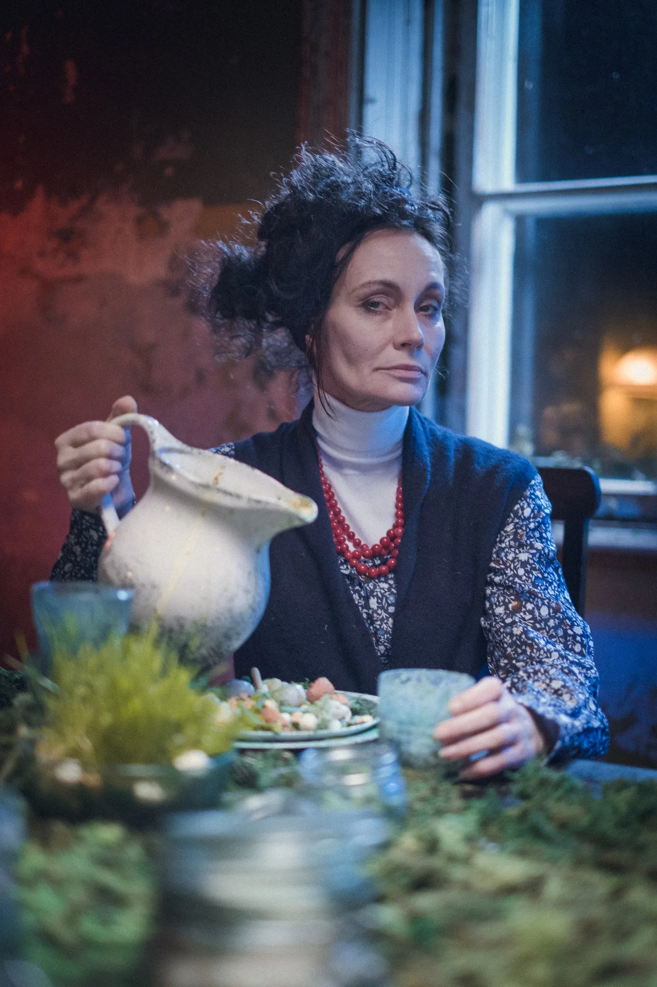 Your Dream – a woman in a vintage dress pours from a white jug at a table