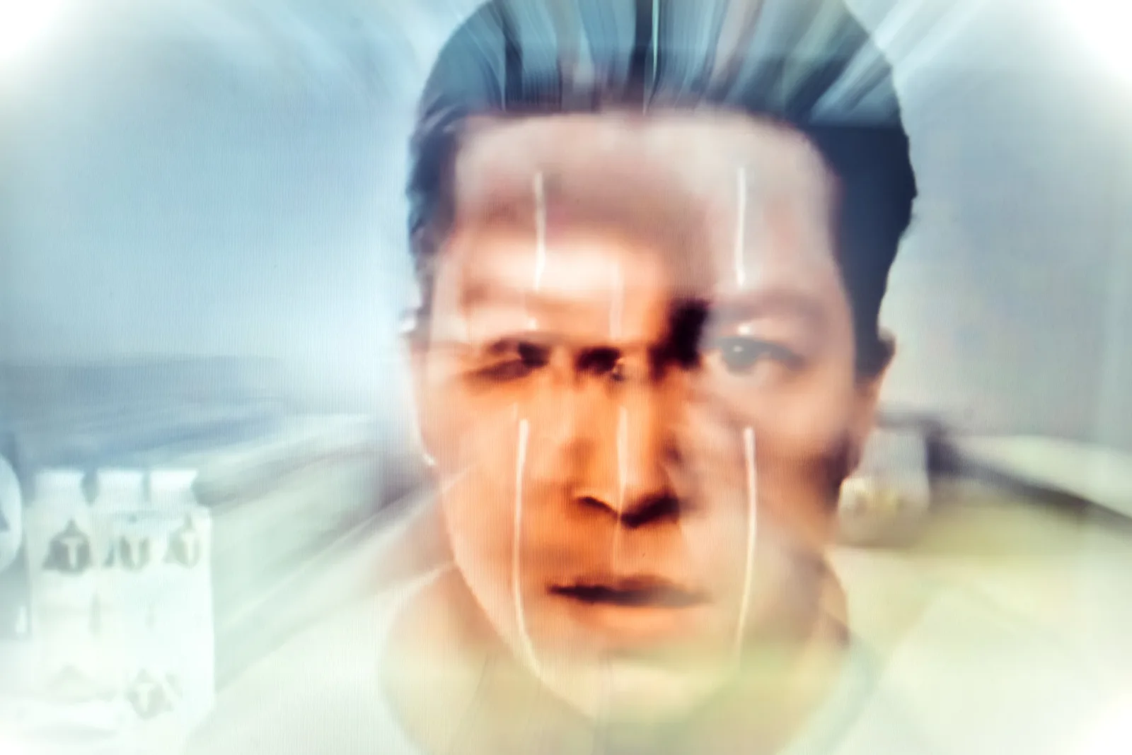 #Protest – a projected male face with light streaks