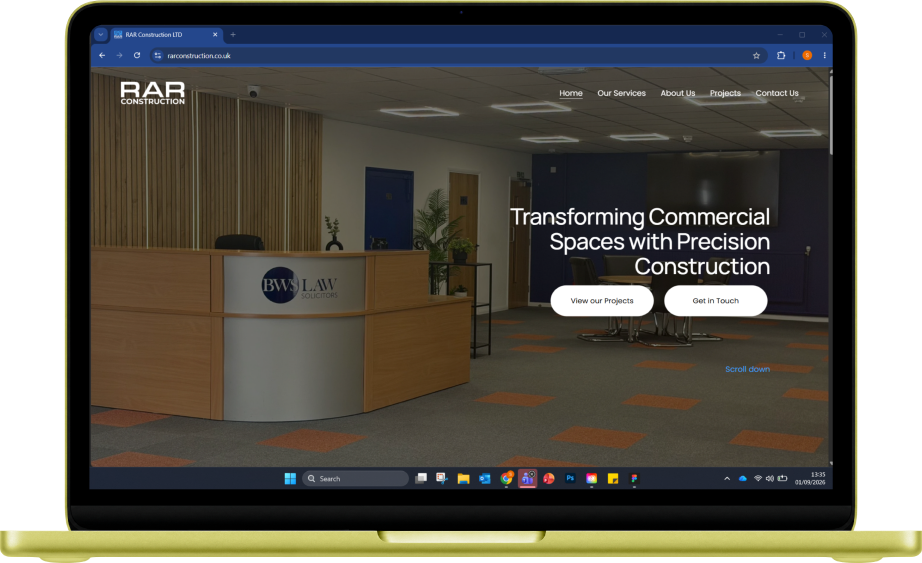 RAR Construction desktop website displayed on a laptop.
