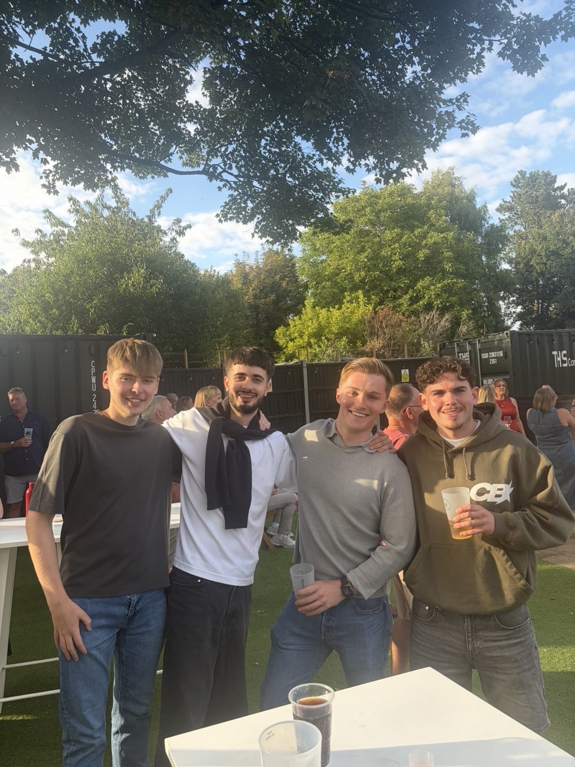 Sam Barnes, second from left, with friends at an outdoor event.
