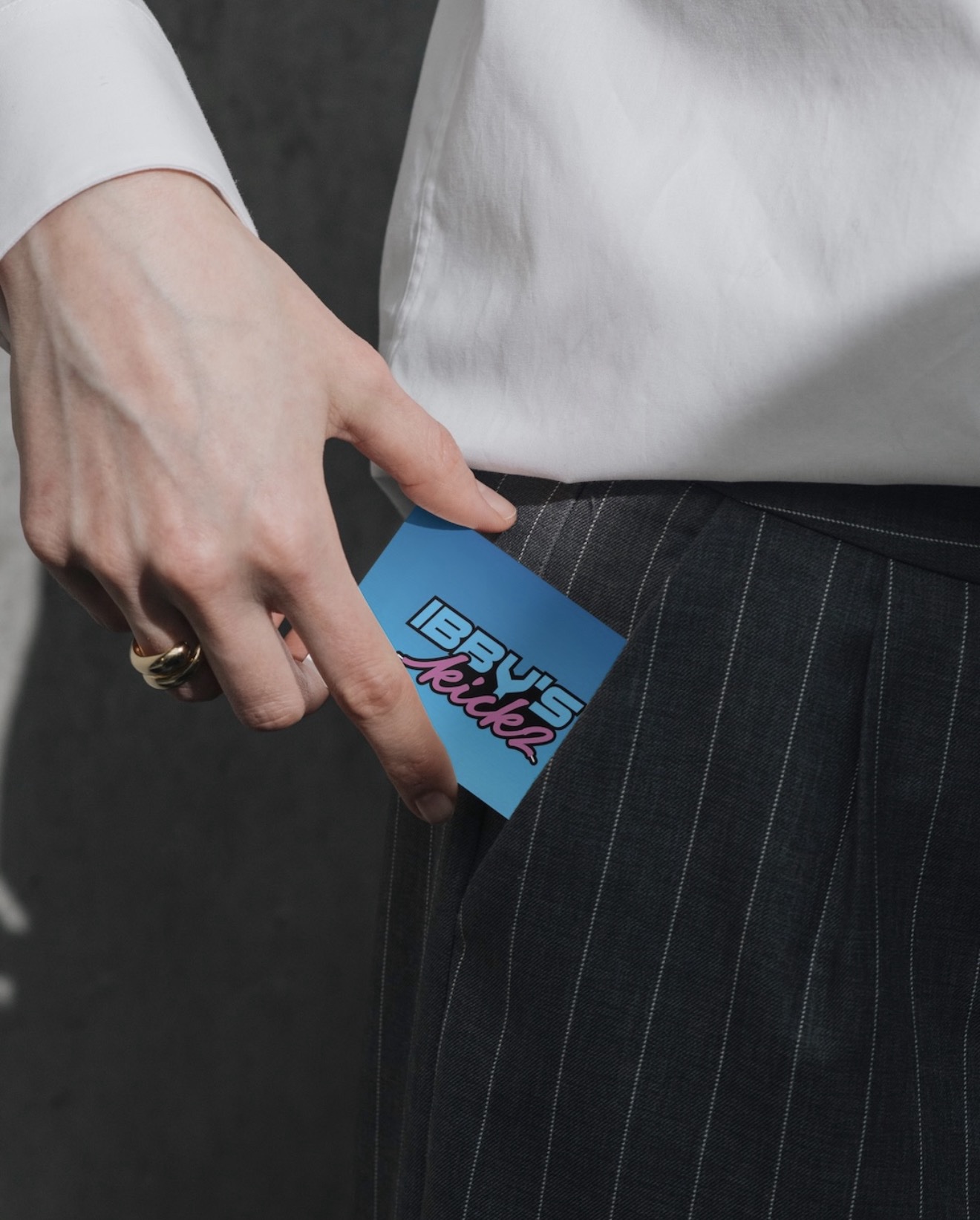 Ibbys Kicks logo and business card design shown on a printed blue card.