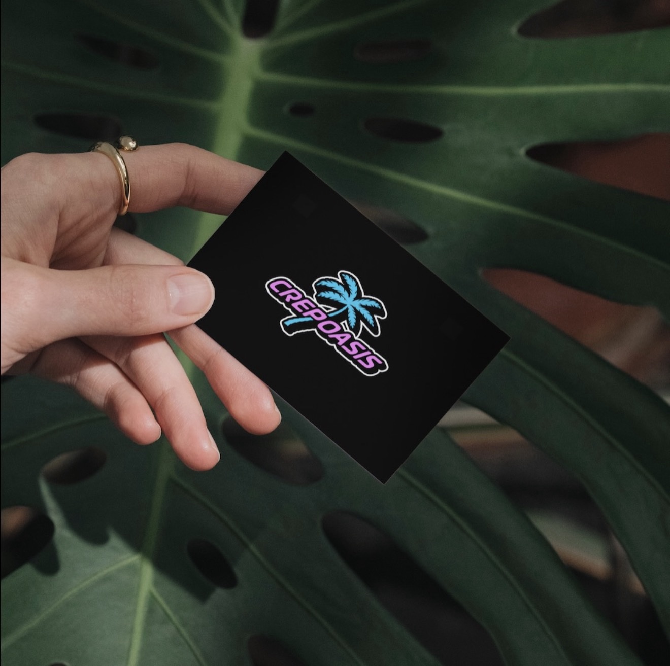 Crep Oasis logo and business card design shown on a printed black card.