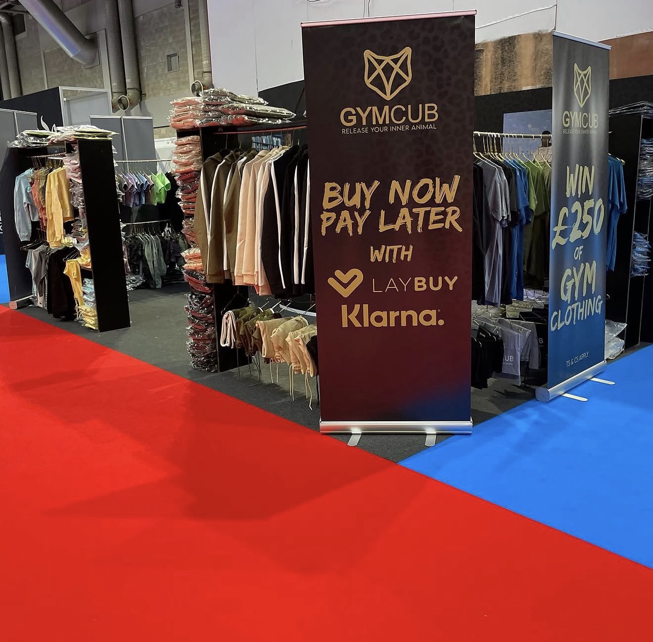 GymCub branded pull-up banners displayed at an exhibition stand.