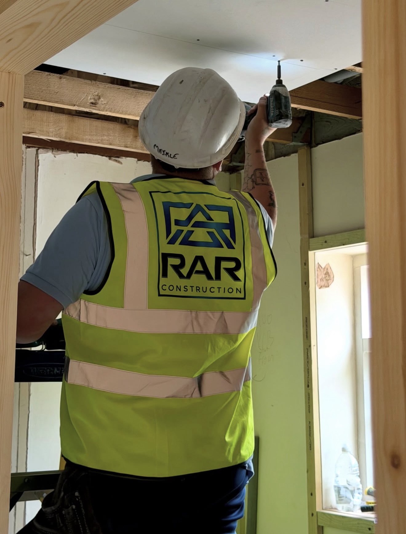 RAR Construction worker carrying out interior work on site.